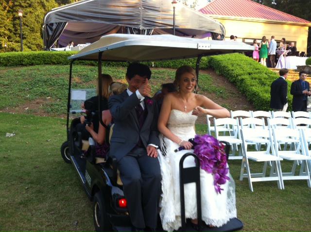 A newlywed couple riding together after a wedding coordinated by Smooth Tie the Knots