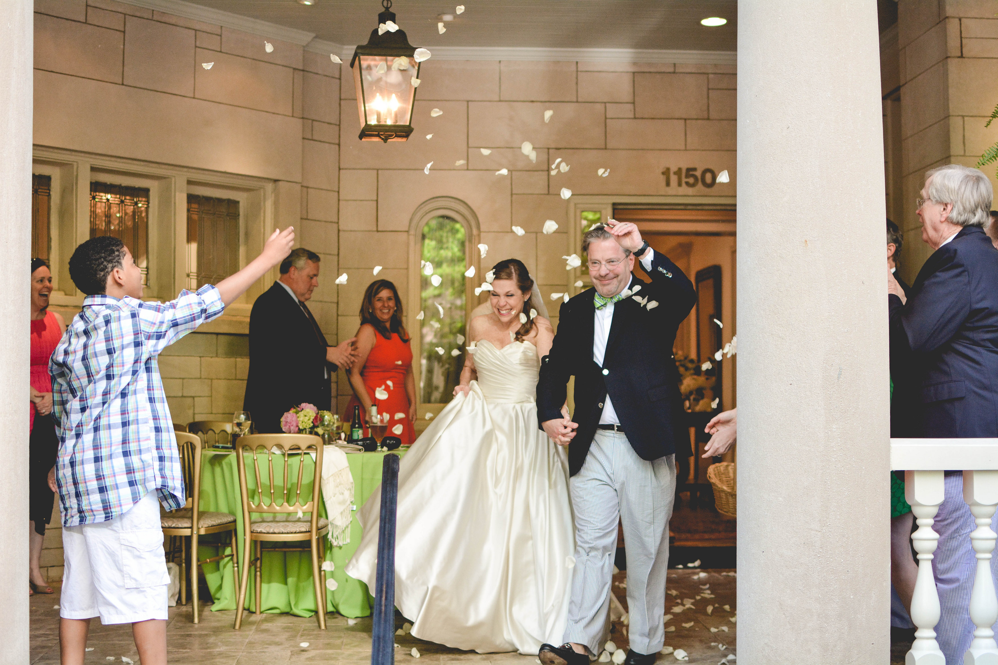 Atlanta wedding bride and groom exit with flower petals