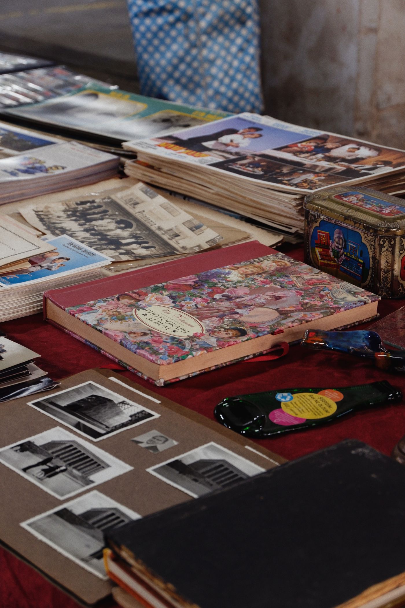 Vintage photo albums and photographs arranged on a table
