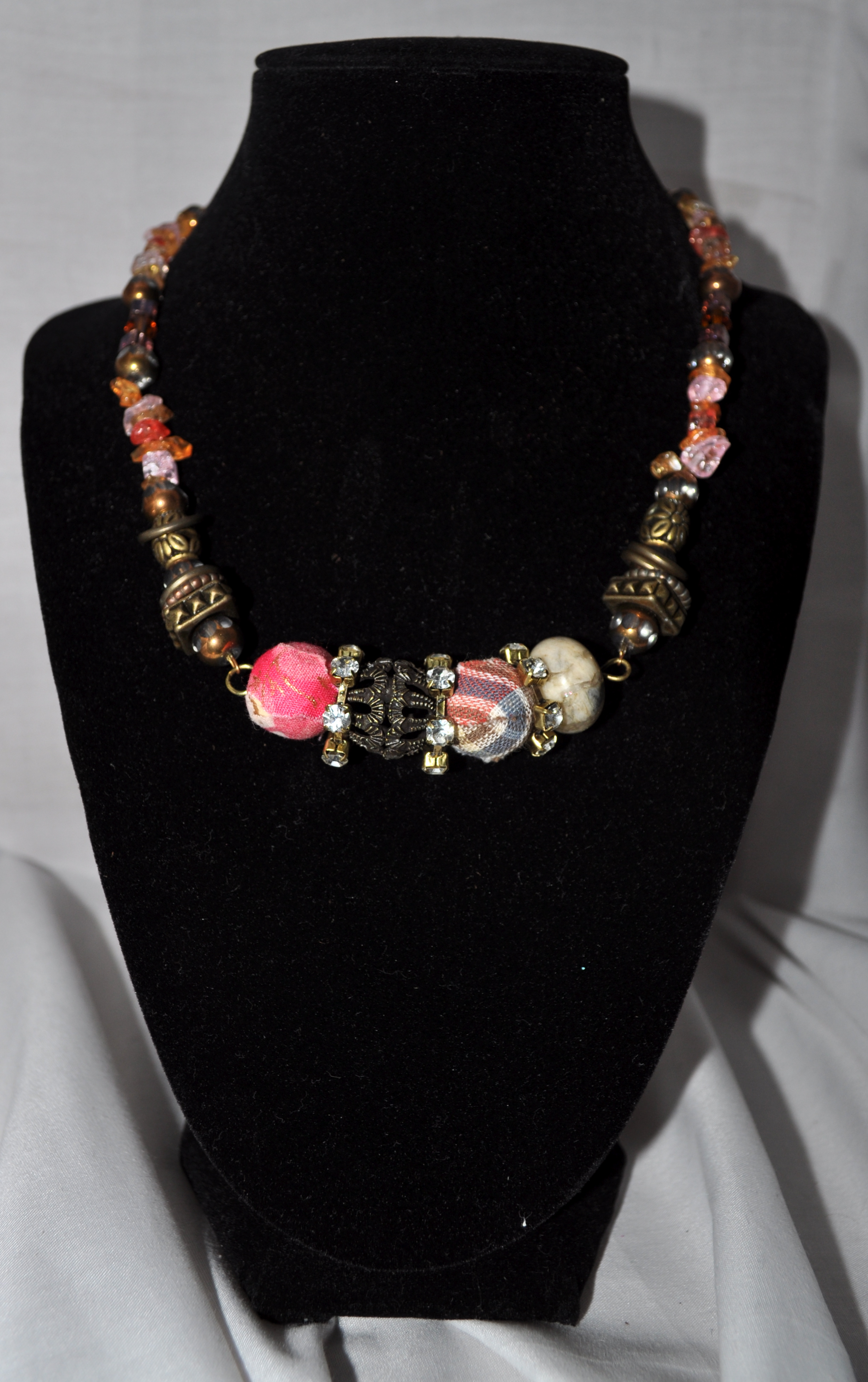 A handmade rose-accented necklace from MelAnne’s Creations