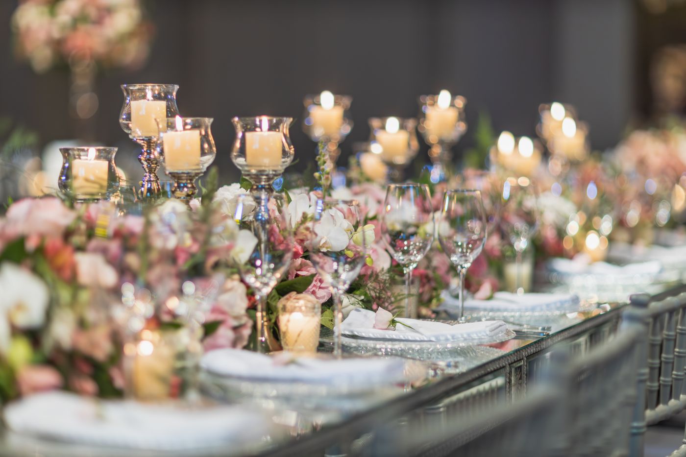 Candles and flowers on an elegantly set reception table