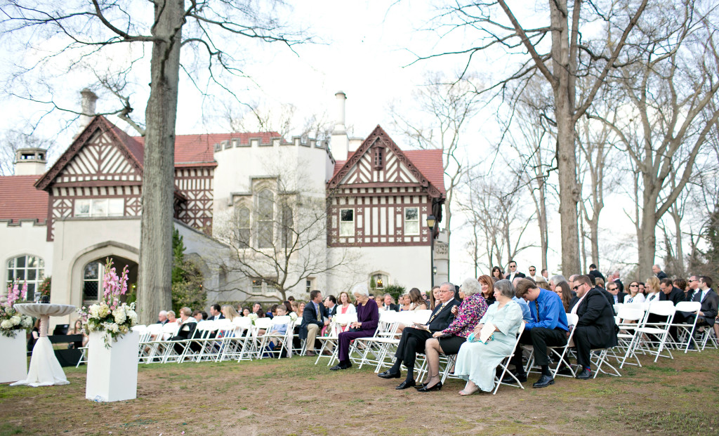 Outdoor flowers and guests in Callanwolde Gardens fine arts center wedding in Atlanta