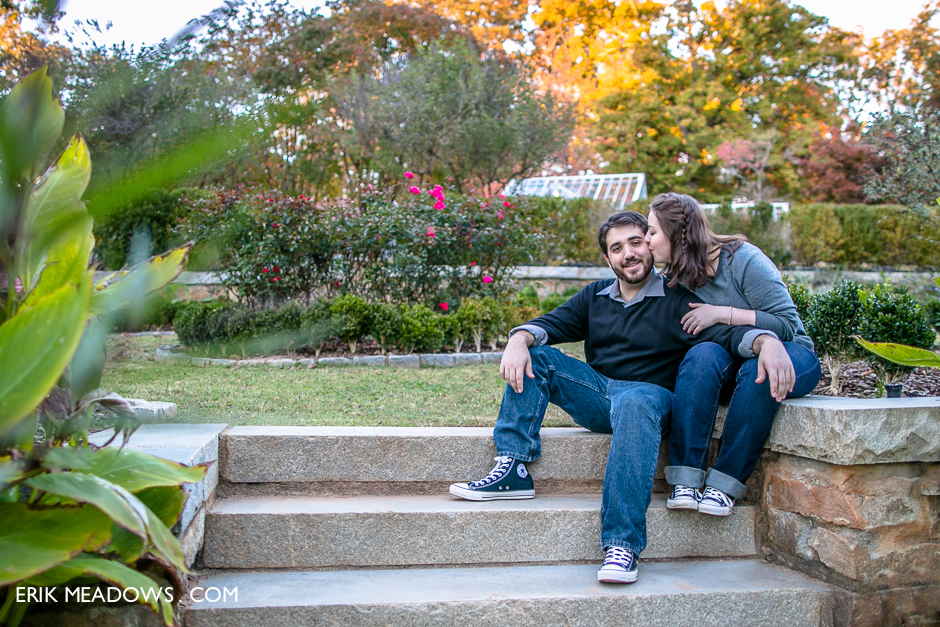 An engaged couple together in the gardens at Callanwolde