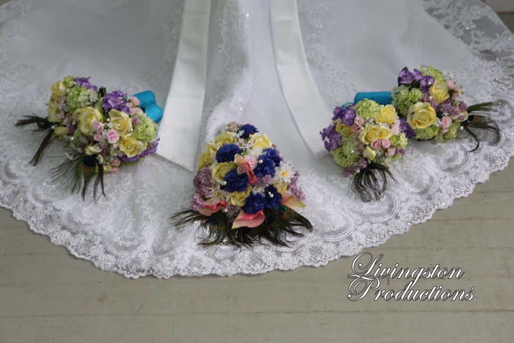 Colorful wedding bouquets arranged on a bridal train