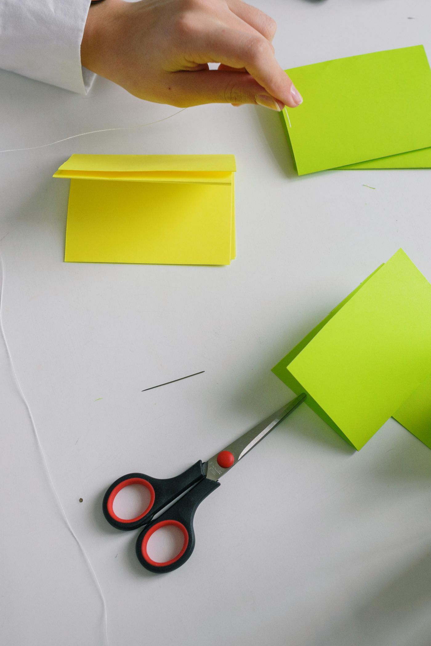Scissors and colorful paper prepared for a craft project