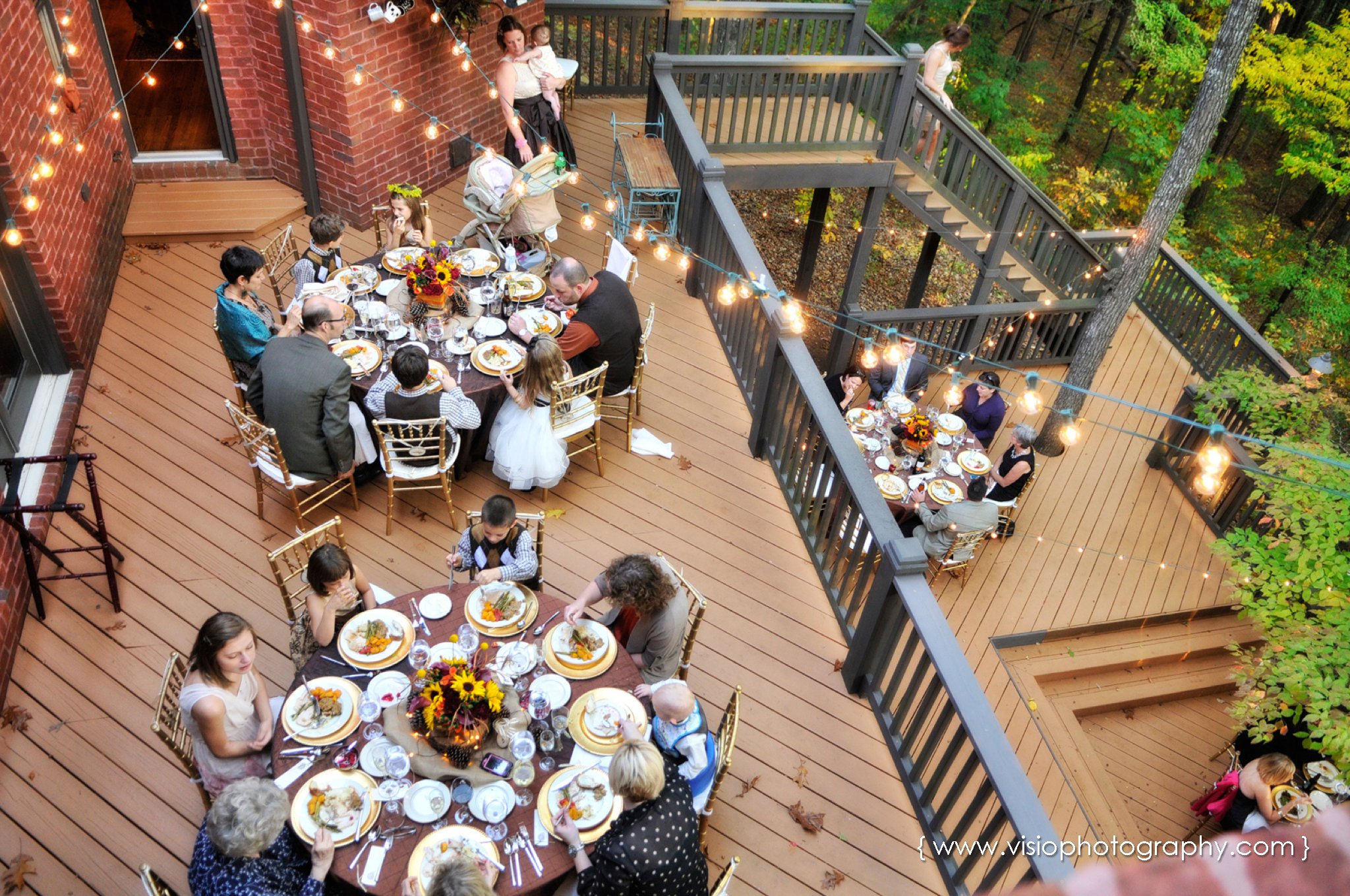 Outdoor wedding reception on back deck
