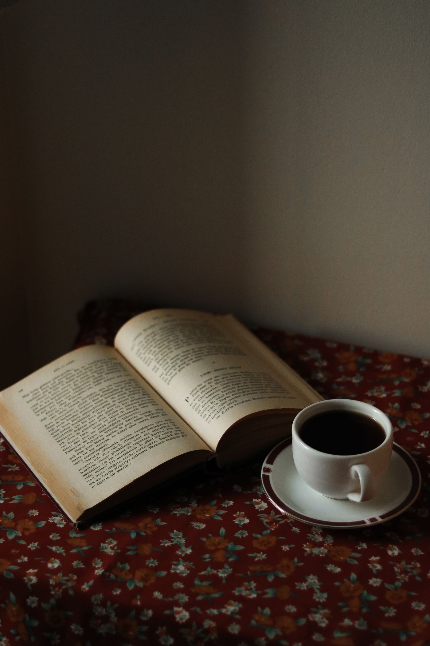 An open book and a warm cup of coffee