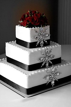 Winter wonderland themed Wedding Cake with silver snowflakes for a December wedding idea