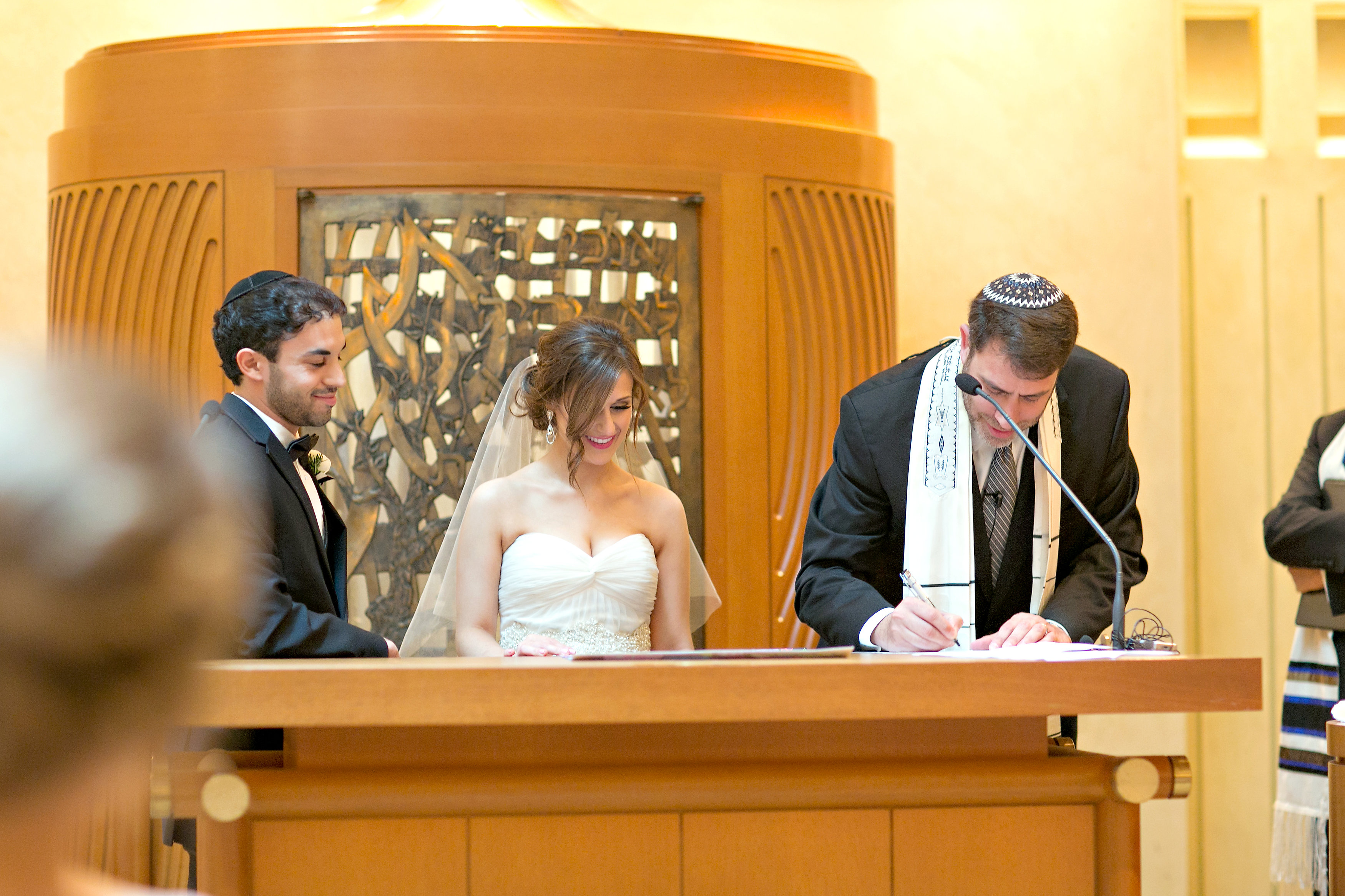 Risa and Jared signing their ketubah at The Temple in Atlanta