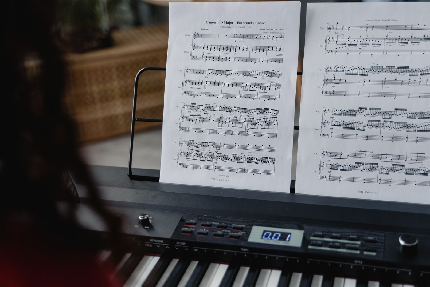 Sheet music resting on a digital piano