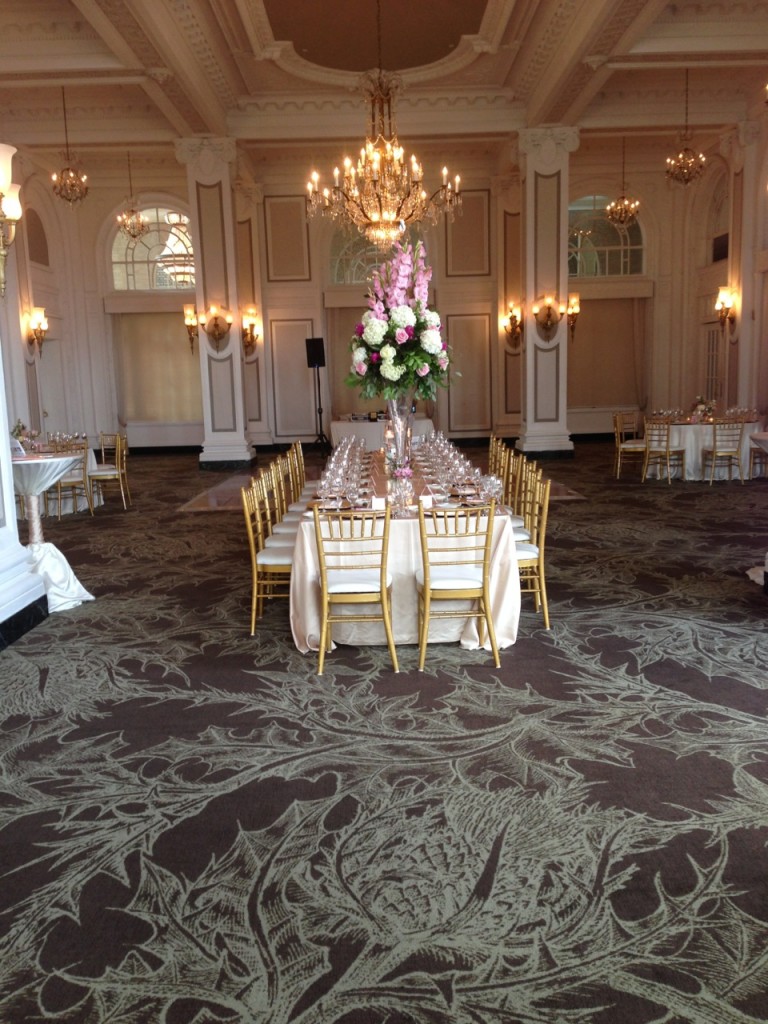 Long reception table with pink and white flowers at Atlanta wedding venue Georgian Terrace hotel