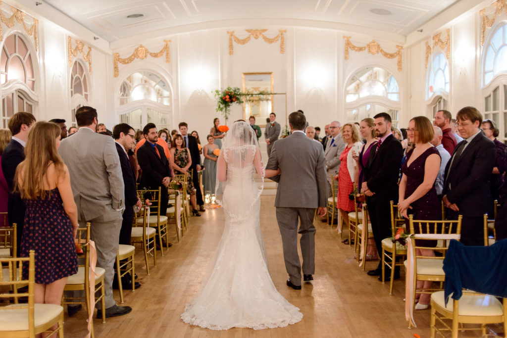 Bride coming down the aisle at Wimbish House wedding ceremony
