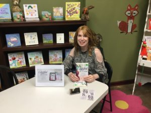 Signing books at Emerging Author Night at FoxTale Book Shoppee