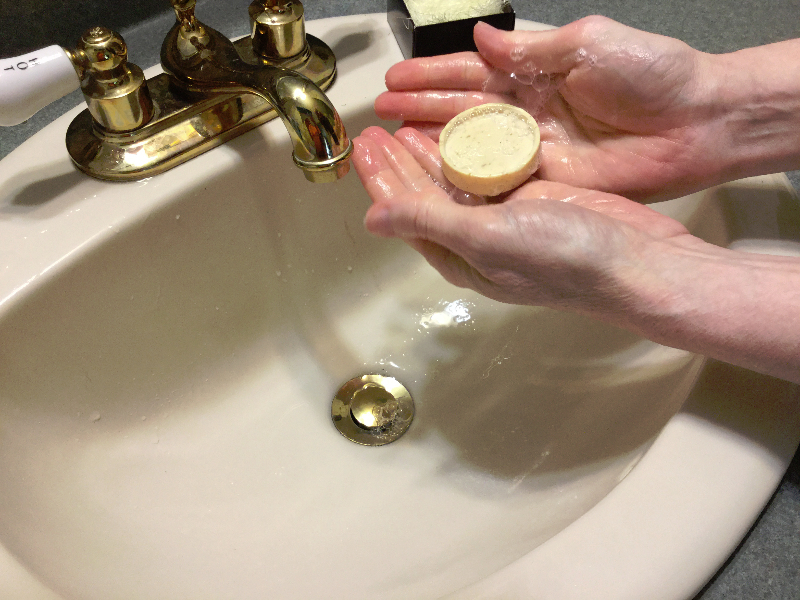 Suds and leather while washing hands with cherry blossom soap favor from My Wedding Favors